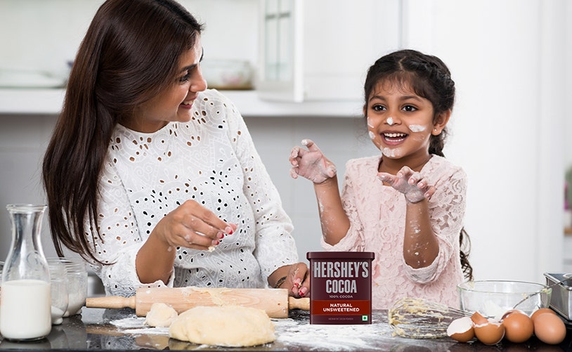 Daughter & Mother Baking inthe kitchen with HERSHEY'S COCOA Natural Unsweetened