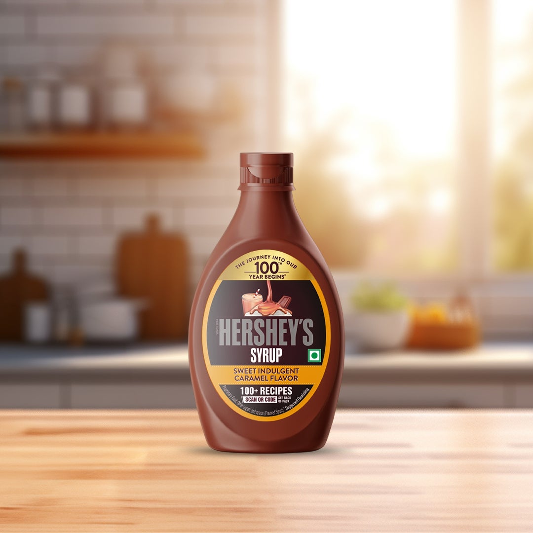 Boy smiling after drinking HERSHEY'S Chocolate flavored SYRUP mixed with Milk